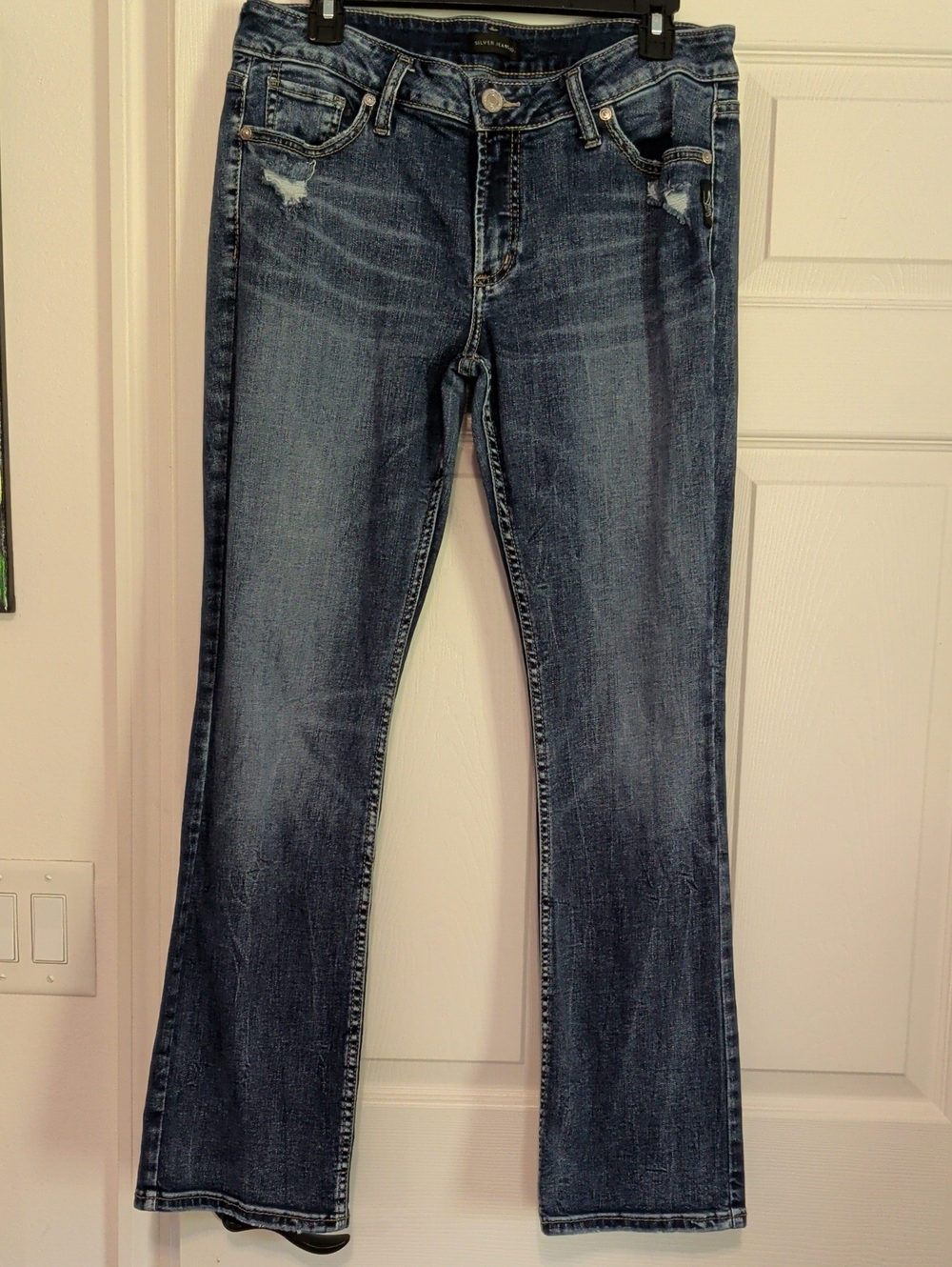 Silver Jeans Medium Blue Flared Jeans with Light Distressing